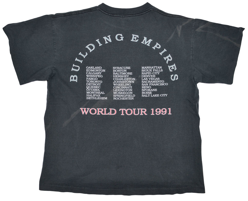 Vintage Queensrÿche 1991 "Building Empires" Tour Shirt The "Building Empire Tour" supported the fourth full-length studio album by Queensrÿche, Empire. The album stands as Queensrÿche's most commercially successful release, reaching triple-platinum status. The album won a 1991 Northwest Area Music Award for Best Metal Recording. Some stains at the back. The tee has a really good fade and vintage look.