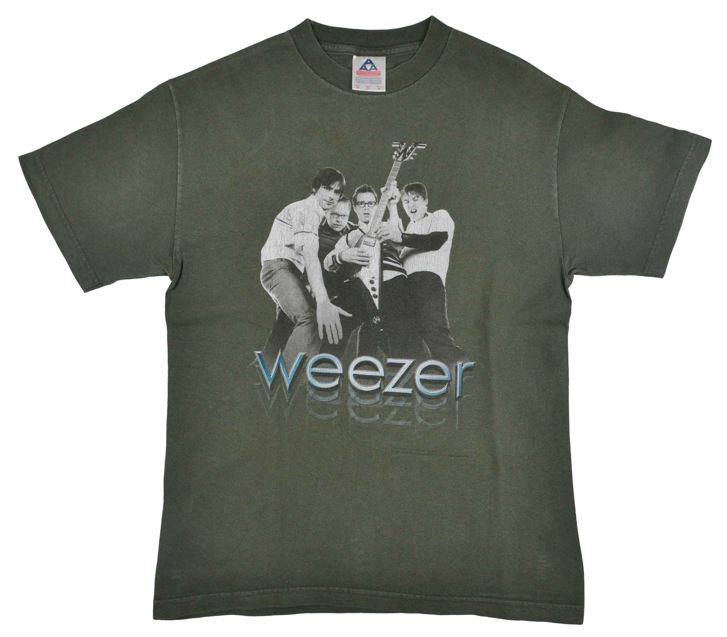 Vintage Band T-Shirt 2002 Weezer "Hyper-Extended Midget" Tour The Hyper-Extended Midget Tour supported the third studio album from the band, Green Album. With a more pop sound, the album was a commercial success and received mostly positive reviews by the fans. It debuted at number four in the United States and the song Hash Pipe was a worldwide hit, charting on seven different charts. The tee has a really good vintage look.