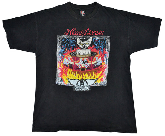 Vintage Aerosmith 1997 "Nine Lives" Tour Shirt  "I Don´t Want to Miss a Thing". Aerosmith is one of the best-selling bands of all time. They have been included into the Rock Hall of Fame in 2001, and in 2005 they were ranked No. 57 on the Rolling Stones list of 100 Greatest Artists of All Time. The tee has a great fade and incredible graphic.