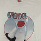 Vintage Comic T-Shirt 1999 Grendel  Grendel is a long-running series of comic books originally created by American author Matt Wagner. Grendel was the masked identity of Hunter Rose, a successful author. As Grendel, he worked as an assassin before taking control of New York City's organized crime. The tee has a good vintage condition.