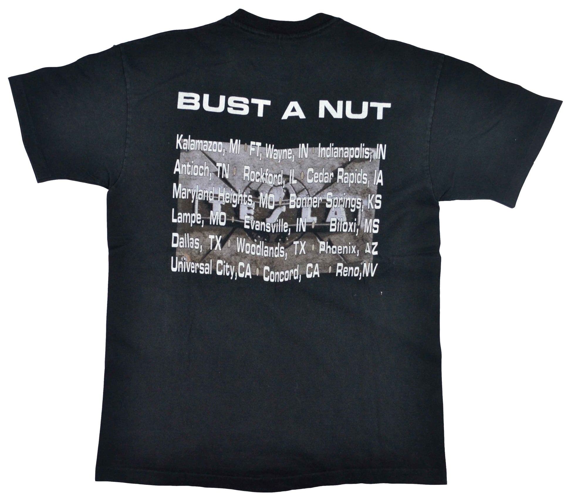 Vintage Tesla 1995 "Bust A Nut" Band Shirt  "Bust A Nut" is the fourth studio album from the american hard-rock band Tesla, released in 1994. In November 2011, the album was ranked no. 10 on Guitar World magazine's top ten list of guitar albums of 1994. The tee has a good vintage look.